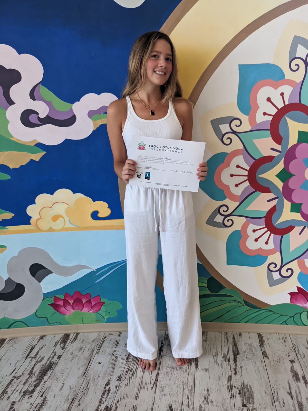 Lola holding yoga certification